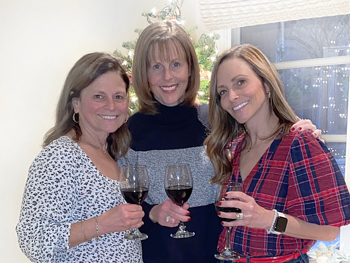 Sorelle Biscotti LLC owners Janine Phillips, Gina Bartlewski and Christina Ferrari holding wine glasses